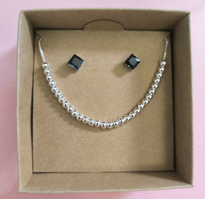 Set Aretes y Pulsera América en Acero Plateado